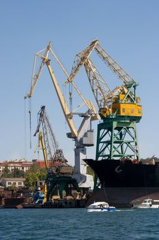 Industrial port with huge cranes