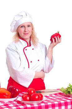 Portrait of attractive cook woman, holding a paprika