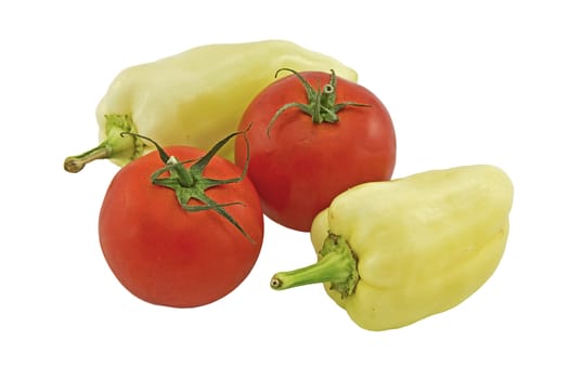 Two bell peppers and two tomatoes isolated on white