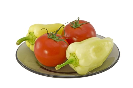  Bell peppers and tomatoes on a plate isolated on white