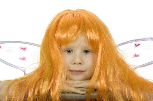 Girl in fancy dress and a wig on a white background