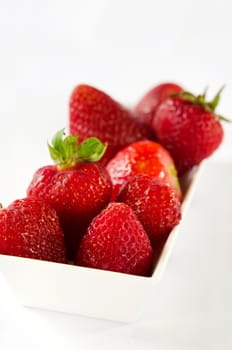 Strawberries berry fruits in white bowl