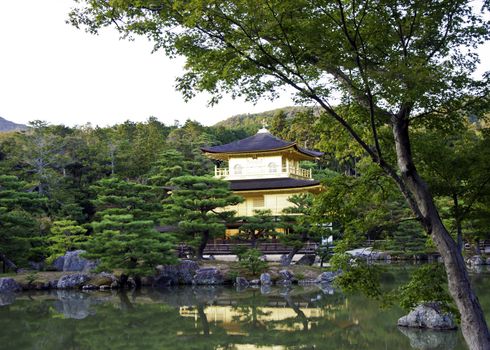 Kinkakuji in autumn season - the famous Golden Pavilion at Kyoto, Japan. 