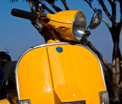 yellow italian retro designed vespa 