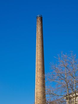 old factory chimney made of red bricks