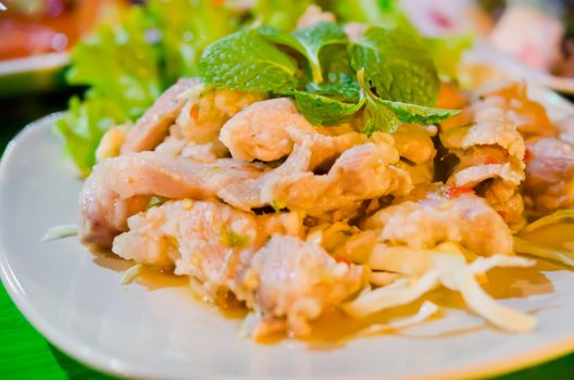 spicy pork salad served with fresh vegetable