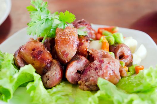 Thai Style Sausage served with chili and fresh vegetable