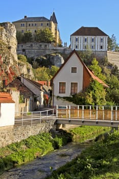 The castle of a city with houses and creek