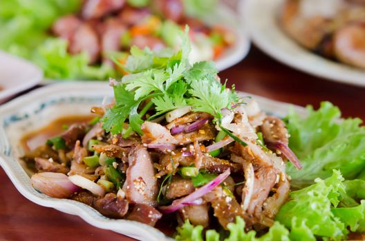 spicy slices pork  with vegetable on dish
