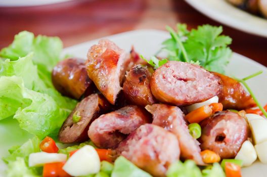 Thai Style Sausage served with chili , garlic and fresh vegetable