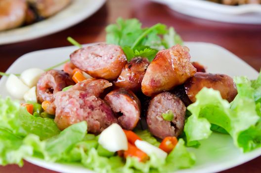 fried  Thai sausage served with chili and fresh vegetable 