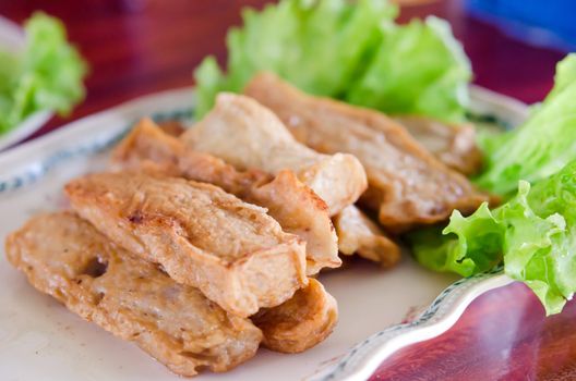 fried vietnamese sausage served with fresh lettuce