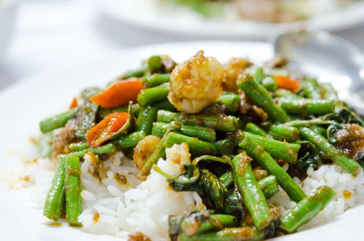 stir fry  chinese cowpea and shrimp with curry sauce over rice