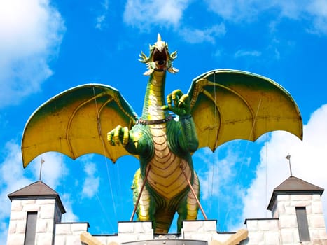 model of a dragon on the roof of the castle