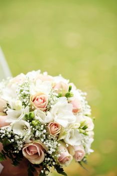 Close up of beautiful and fresh bride flowers bouquet