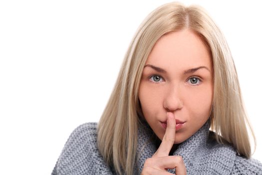 Closeup of charming blonde quiet gesture on a white background