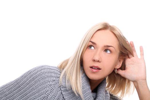 Charming blonde listening gesture on a white background