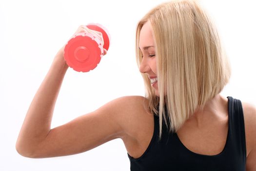 Slim and sporty girl do exercise with red dumbbells