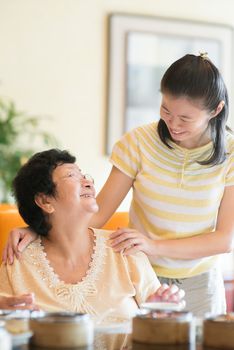 Asian Chinese family interaction inside a restaurant