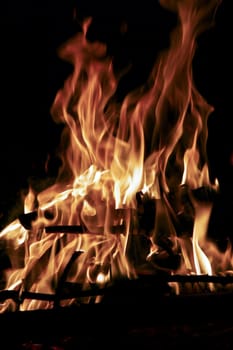 Closeup of a big flaming bonfire at night