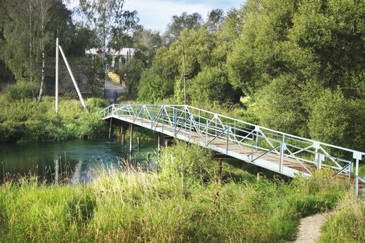 Pedestrian bridge over the river were taken to the city Kohma. Russia