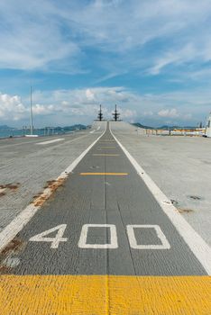 Concrete fighter jet run way of an aircraft carrier, taken on a sunny day in Thailand