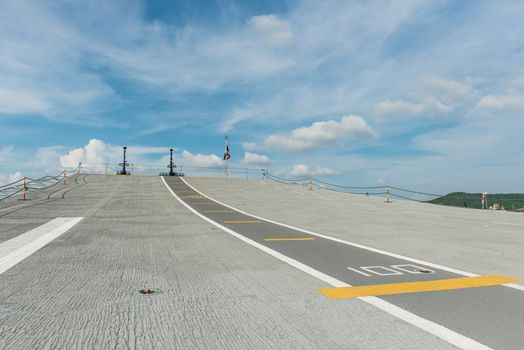 Concrete fighter jet run way of an aircraft carrier, taken on a sunny day in Thailand