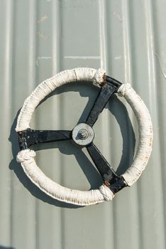 White metal door wheel, taken from battle ship water tight door handle, isolated in white