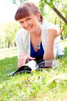 portrait of a beautiful woman, spending time in a summer park