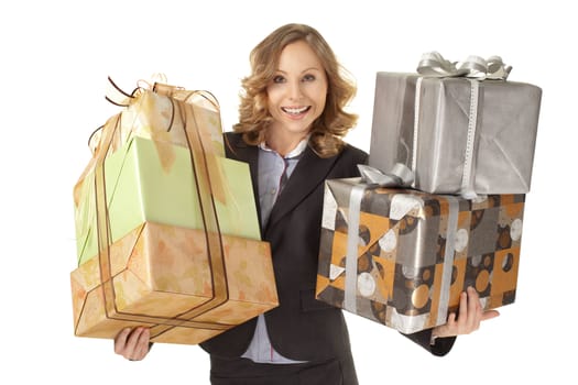 Smiling businesswoman holding giftboxes on white background, looking at camera