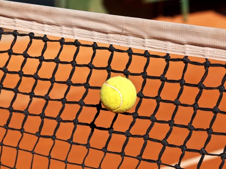 tennis ball stack in the net