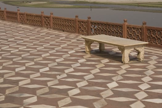 Marble bench on a tiled terrace overlooking the River Yamuna at the Taj Mahal, Agra, India