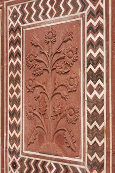 Detail of decoration on the mosque at the Taj Mahal. Mughal style building of red sandstone inlaid with marble. Agra, Uttar Pradesh, India