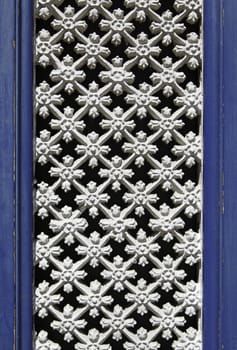 Old fence in a window, detail of a window in the city of Braga, Portugal, Europe