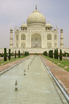 Taj Mahal. White marble mausoleum set in formal gardens in Agra, India.