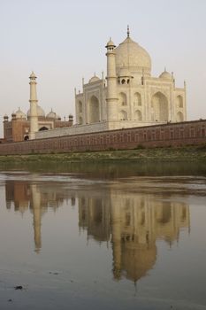 Taj Mahal reflected in the River Yamuna at sunset. Agra, Uttar Pradesh, India