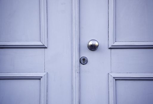 Old blue door, detail of a door in the city of Lisbon, Portugal