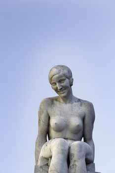 Statue of woman, detail of a stone statue in the city of Lisbon