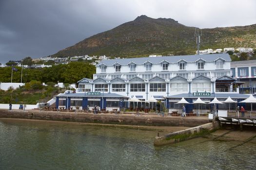 Historic buildings around the harbour in the coastal town of Simons Town, South Africa.