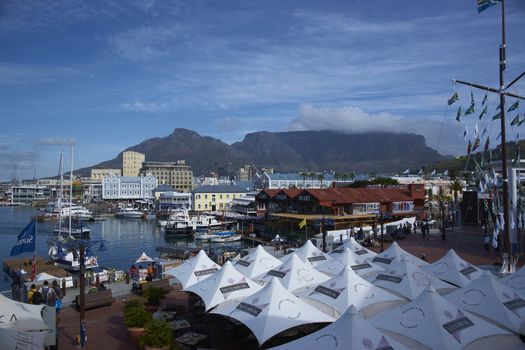 Historic buildings and restaurants in the Victoria and Albert Waterfront in Cape Town in South Africa. Table Mountain in the background.