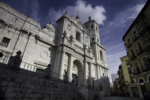 Facade of Valladolid Cathedral with typical buildings, Valladolid, Spain