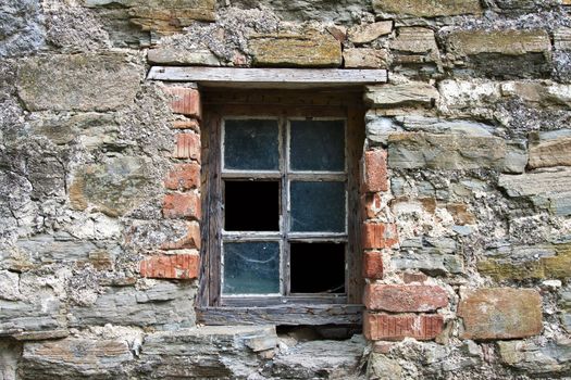 old wooden window frame with broken glass