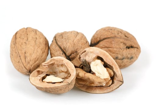 walnut and a cracked walnut isolated on the white background