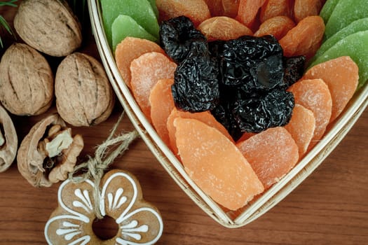 Christmas Dried Fruit and Nuts  on wooden background