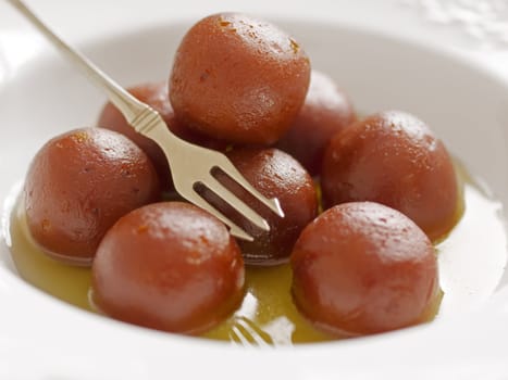 close up of indian dessert gulab jamun