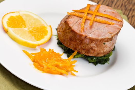 fried tuna fillet with fresh orange ,orange sauce and spinach