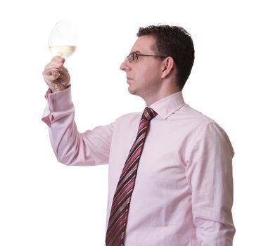 Portrait of a man with tie tasting a glass of white wine