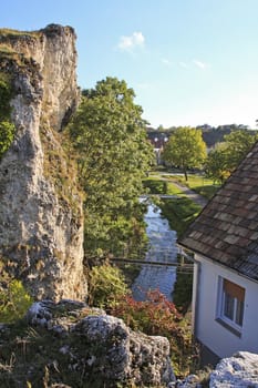 View with a house, park and a creek