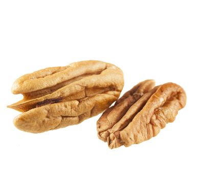 Shelled pecans isolated on white background.
