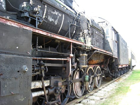The image of ancient black steam locomotive